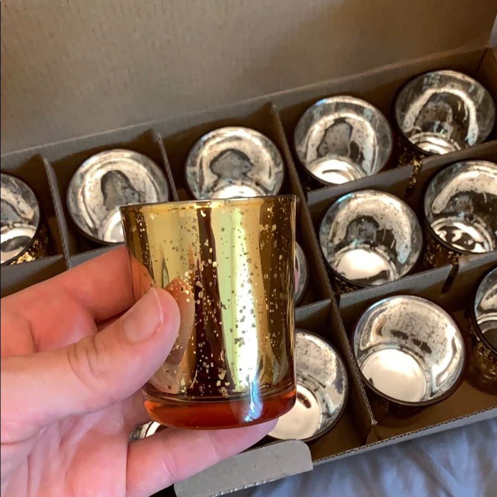 Gold mercury votive holders.